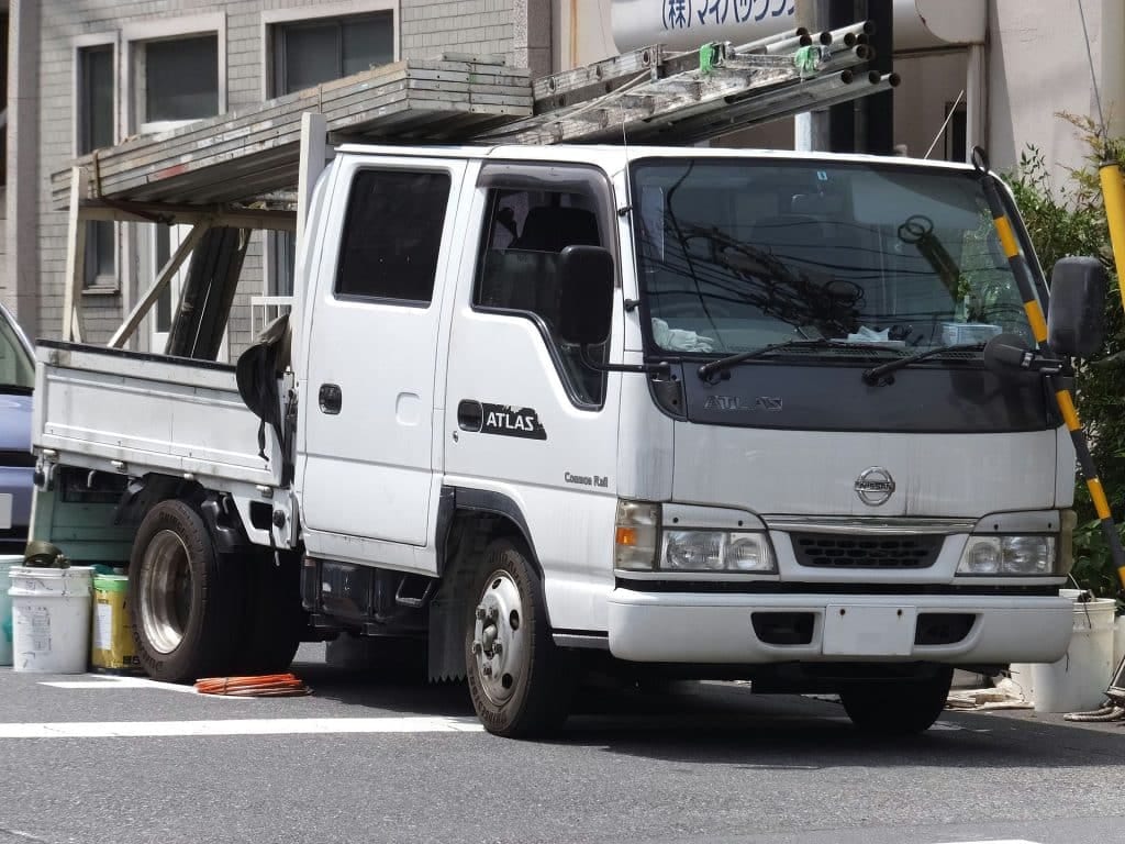 A white truck parked on the street.