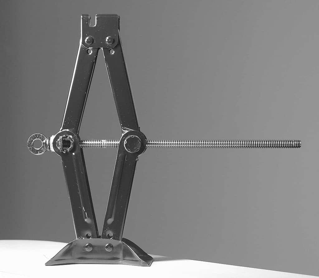 A black and white image of a metal frame on a table.