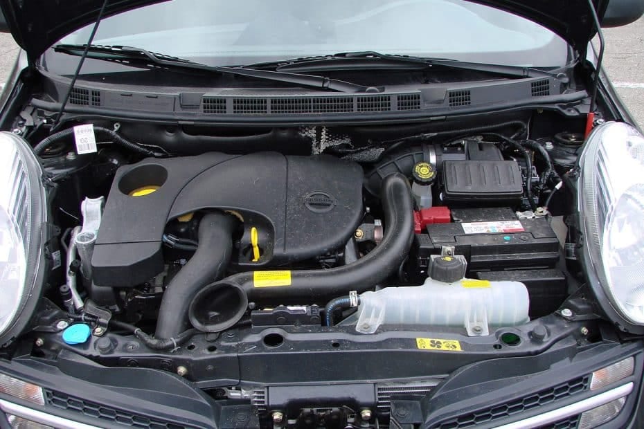 A black car with a hood open.